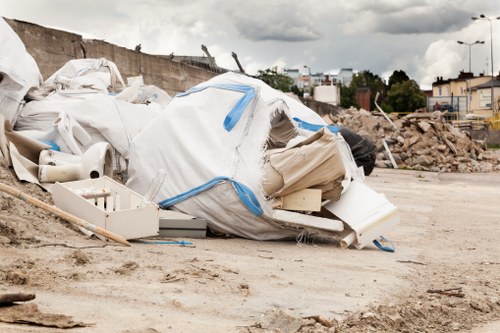 Demolition site with construction workers and machinery
